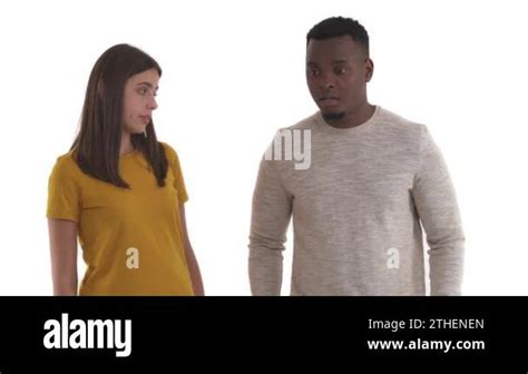 African Man Staring On Something And His Caucasian Girlfriend Slapping