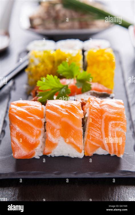 Various Kinds Of Sushi Food Served On Black Stone Stock Photo Alamy