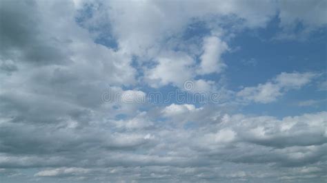 White Puffy Clouds Forming On Summer Blue Sky Dark Grey Storm Clouds