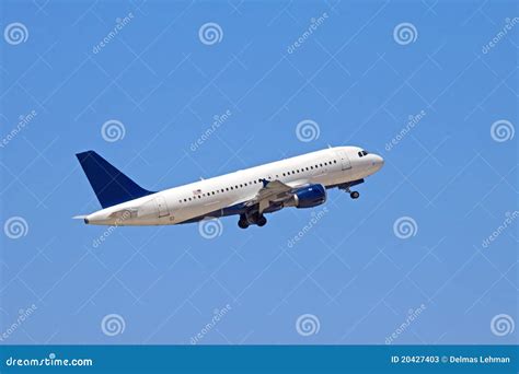 A Jet Plane Flying Into A Blue Sky Stock Image Image Of