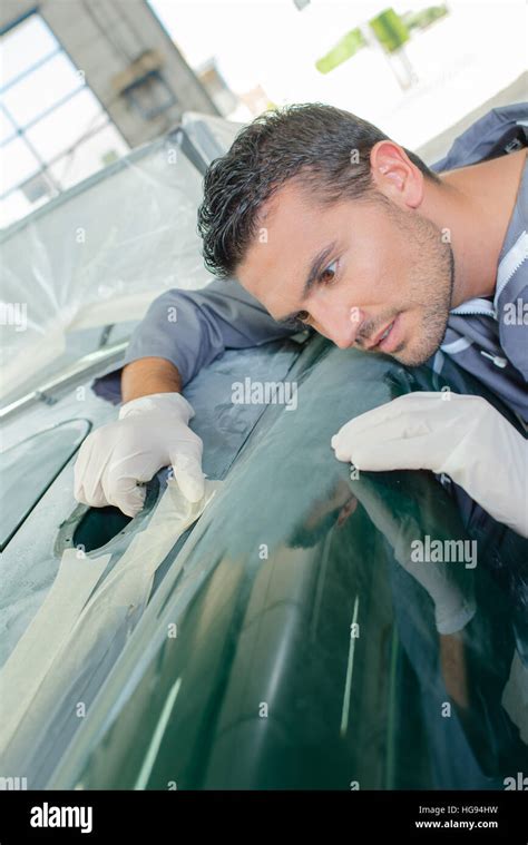 Mechanic Assessing Finish Of Classic Car Stock Photo Alamy