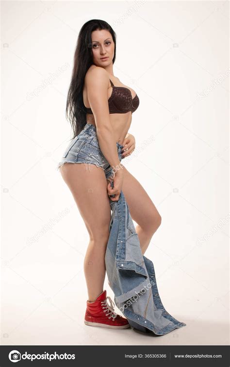 Fashionable Brunette Beautiful Woman Posing Studio Wearing Short Jeans