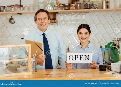 Confident Gay Boss Standing And Holding The Folder Stock Photo Image Of Business Success