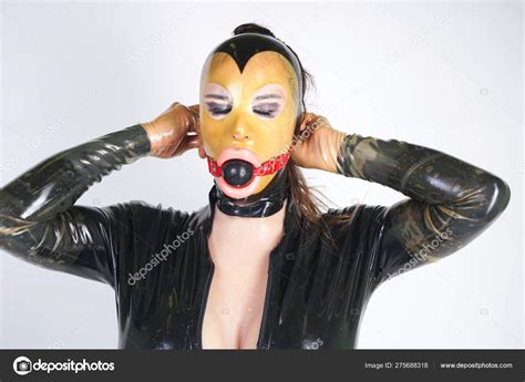 Hot Curvy Crossdresser Wearing Latex Rubber Mask Black Fetish Costume Stock Photo By Agnadevi