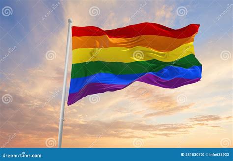 Gay Pride Flag Waving In The Wind At Cloudy Sky Freedom And Love