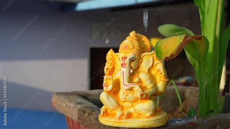 Water Splash On Lord Ganesha Sculpture Celebrate Lord Ganesha Festival