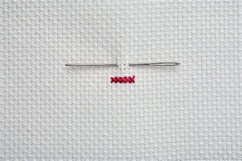 the needle has been stitched in with red thread