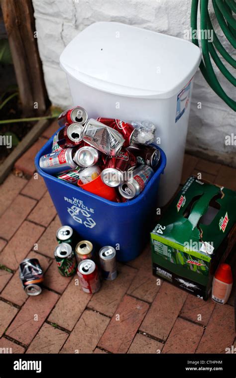 Recycling And Trash Bins Filled With Recyclables Stock Photo Alamy