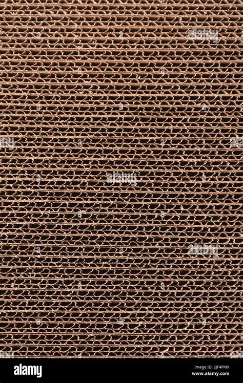 Close Up Of Stacked Brown Corrugated Cardboard Texture Side View Stock