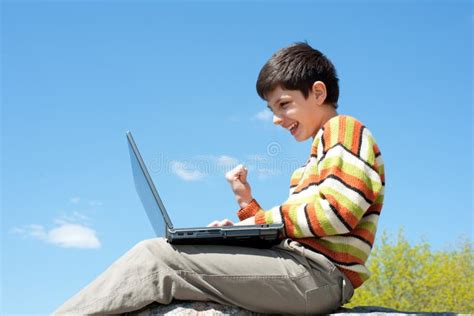 Excited Boy Playing With Wireless Laptop Stock Photo Image Of