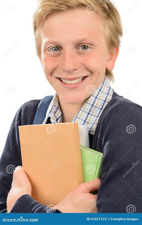 Estudiante Adolescente Alegre Que Sostiene Los Libros Imagen De Archivo