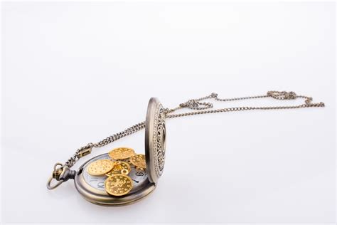 Fake gold coins on a pocket watch 14830499 Stock Photo at Vecteezy