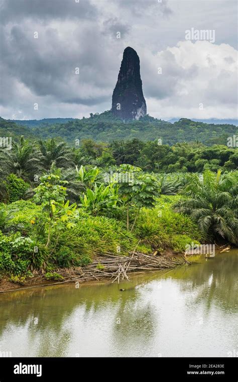 River flowing before the unusal monolith, Pico Cao Grande, east coast