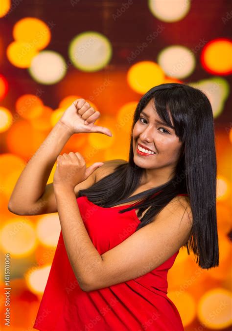 Brunette Model Posing Happily In Front Of Blurry Lights Background Interacting Using Hands