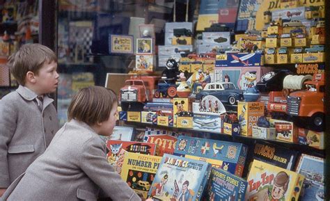 Children stare at toys of a toy shop in Henley, UK, 1960 ~ vintage everyday