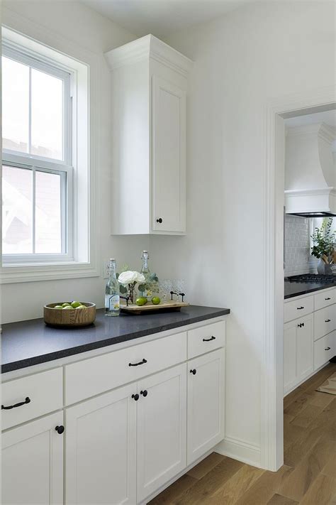 White Dove Kitchen Cabinet With Black Granite