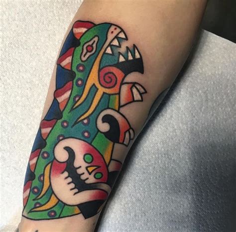 A Colorful Tattoo On The Arm Of A Person With A Skull And Headdress