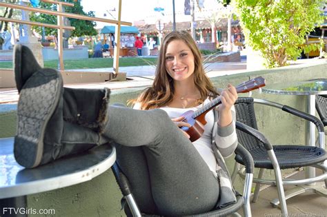 Brown Haired Babe With A Winning Smile Plays Guitar With Her Tits Out