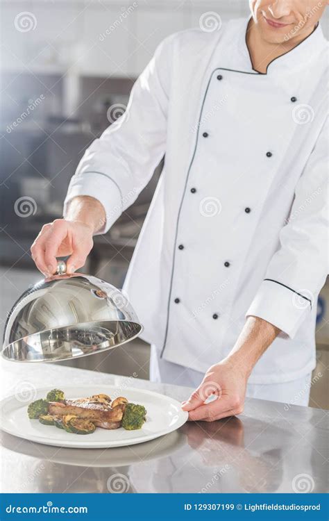 Cropped Image Of Chef Covering Plate With Lid Stock Image Image Of