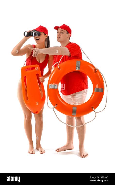 Lifeguards With Ring Buoy Rescue Tube And Binoculars Spotted Something