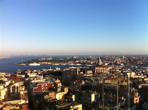 Enjoying a glass of red and taking in the stunning view from a rooftop bar in Istanbul, Turkey ...