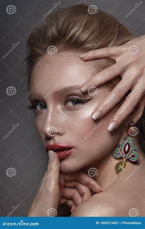 Beauty Gentle Glamour Woman Portrait Blond Long Hair Collected With Ear Rings Nude Style On Grey