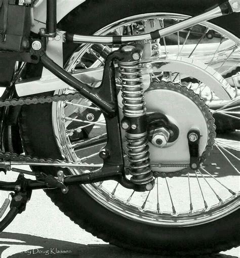 Black And White Photograph Of The Front Wheel Of A Motorcycle