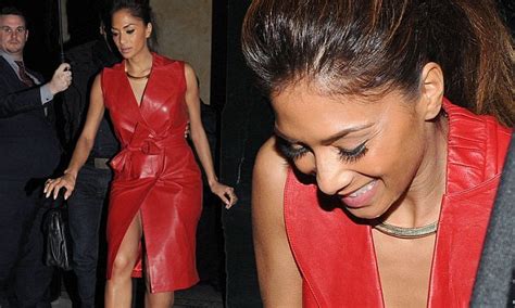 Nicole Scherzinger wows in a red leather coatdress as she attends music ...