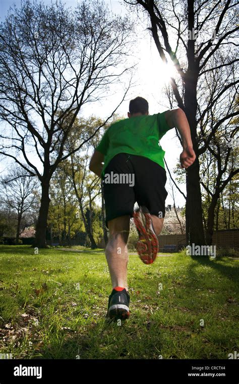 man running  meadow stock photo alamy