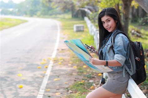 Premium Photo Woman Reading Map On Road