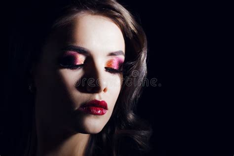 Portrait Of A Young Luxurious Woman In A Low Key Bright Makeup With