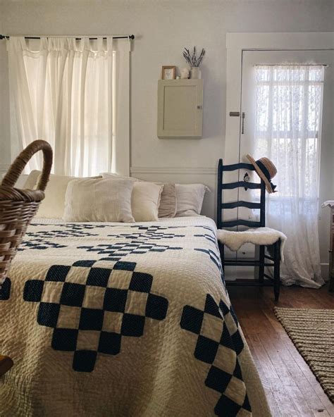 A Bedroom With A Bed Chair And Window