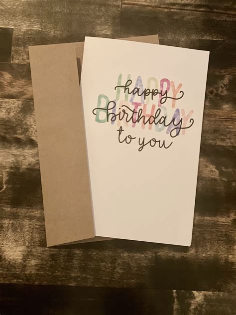 Two Greeting Cards With The Words Happy Birthday To You Written On One