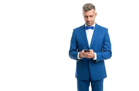 Premium Photo Man In Blue Bow Tie Suit Chat On Phone Isolated On White