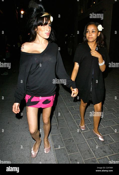 Amy Winehouse And Her Goddaughter Dionne Bromfield Holding Hands As