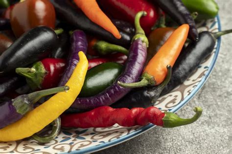 Mix Of Hot Cayenne And Jalapeno Peppers On A Plate Stock Image Image Of Yellow Vegetable