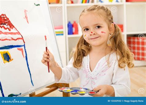 Happy Little Artist Girl Painting A House Stock Photography Image