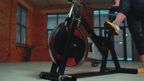 Woman performs aerobic endurance training workout cardio routine on the