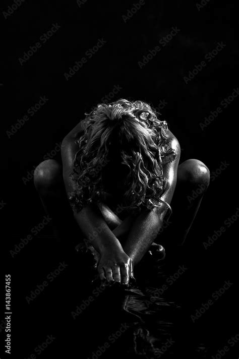 Beautiful Sexy Naked Kinky Blonde Female Sitting On The Floor In The Darkness She Stretching