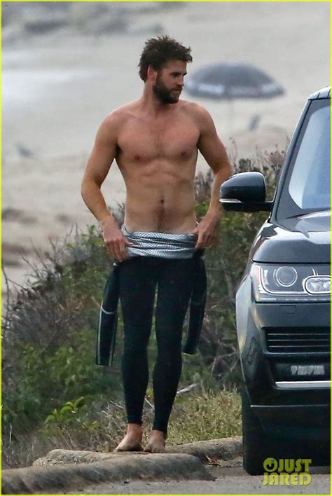 Liam Hemsworth Bares Ripped Abs While Stripping Out Of Wetsuit Photo 3796114 Liam Hemsworth