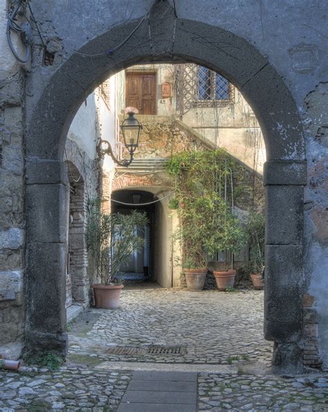 File:Archway and courtyard within former Capena monastery.jpg ...