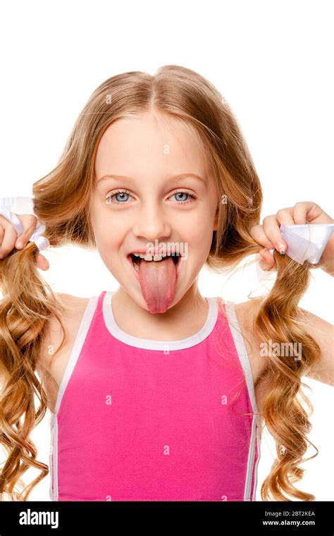 Girl In A Pink Top Shows Tongue Stock Photo Alamy