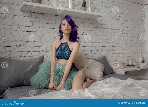 Charming Woman In Lingerie Lying On The Bed In The Room Stock Photo