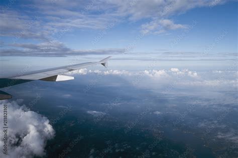 Looking Down To Earth From The Window Of Airplane Land Sea Clouds Sky