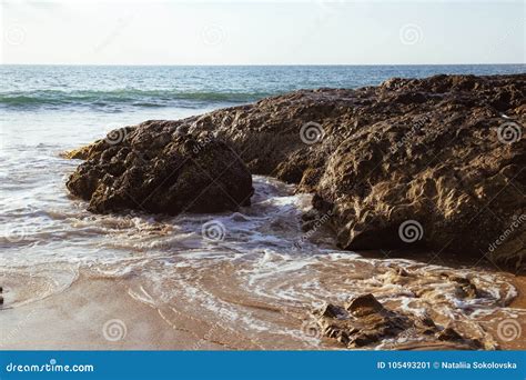 View Of Calm Sea With Stones And Vacationers Stock Image Image Of