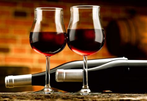 Premium Photo | Glasses of red wine in a tasting cellar