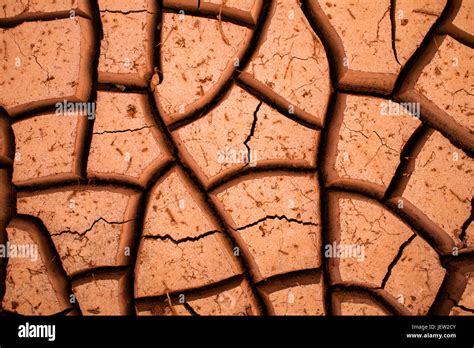 Desert Cracks In Dry Red Clay Stock Photo Alamy