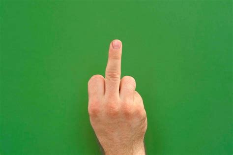 Premium Photo Abusive Gesture Fuck On Chromakey Male Hand Shows Middle Finger Offensive