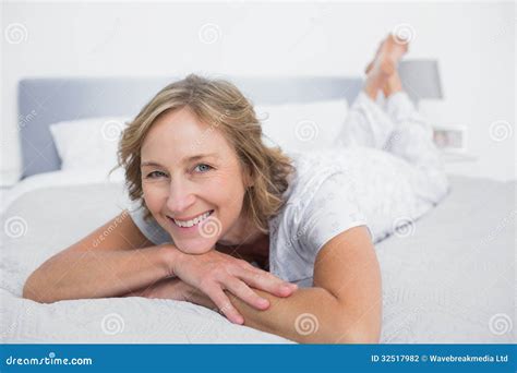 Happy Blonde Woman Lying On Bed Stock Photo Image Of Camera Bedroom 32517982
