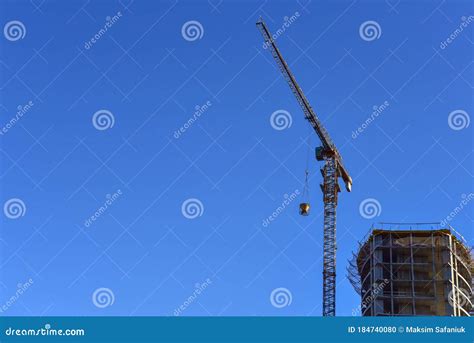 Tower Crane Lifting Concrete Bucket For Pouring Concrete During